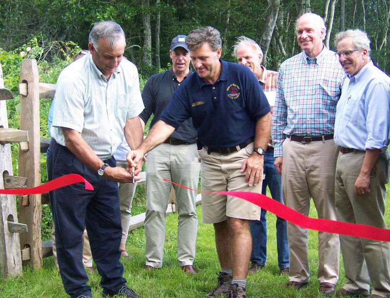 Mattapoisett Town Administrator Mike Gagne, left, and Fairhaven Selectman Robert Espindola officially open Shaws Farm Trail to the public. BY MATTHEW BERNAT